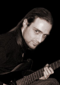 Andreas Hilbert playing guitar